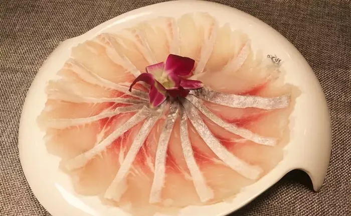Fish slices arranged on a plate at Beiheiguo