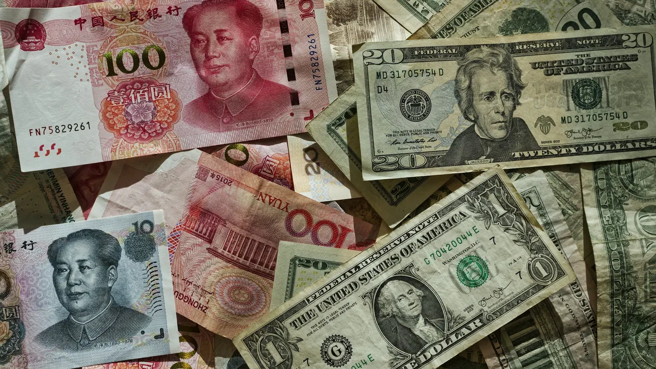 Chinese renminbi and US dollar banknotes arranged together