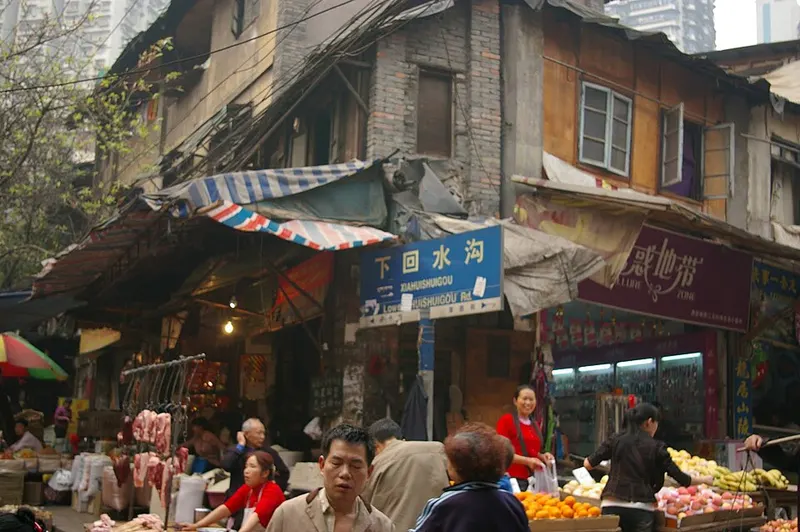 People and stalls in a traditional market in Chongqing