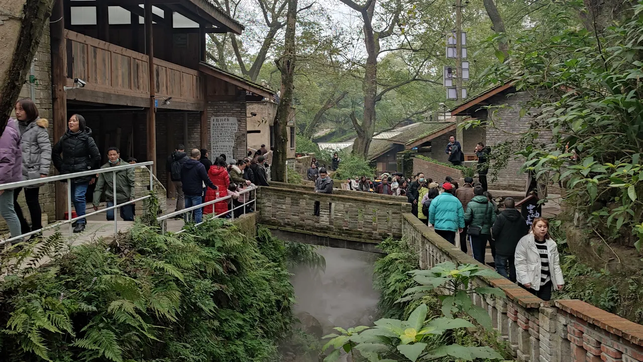 Traditional houses beside a steaming creek in Jingangbei