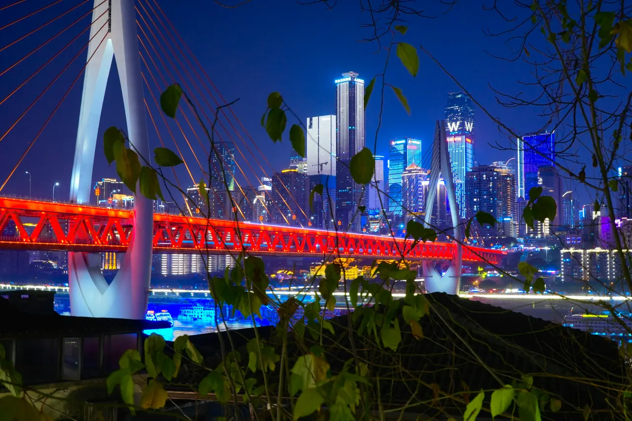 Dongshuimen Bridge and the lit Yuzhong skyline seen from Longmenhao