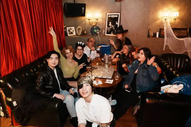 Guests at tables during a Halloween party at BB FUNK Jazz Club