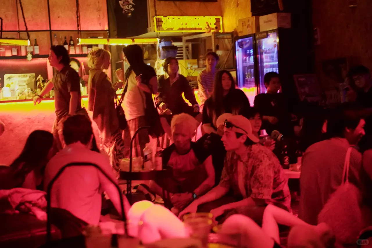 Party guests and warm red lighting inside Cici Park