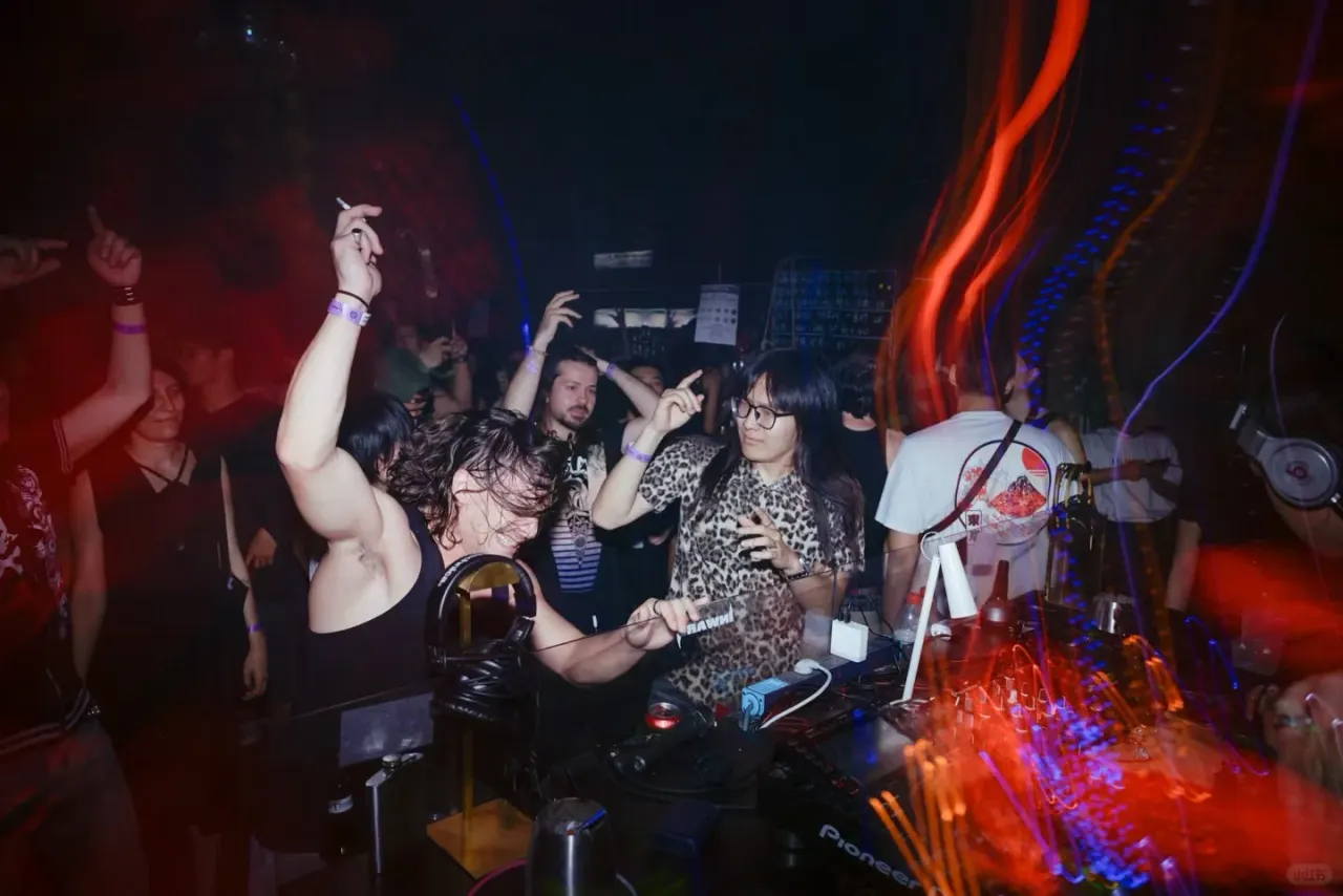 DJ equipment and dancers beside the booth at Inward Club