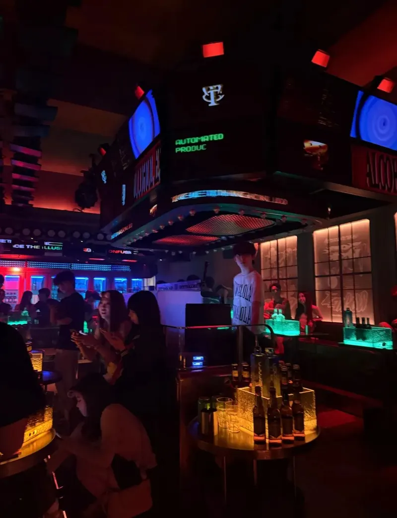 Tables, booth seating and lighting screens inside TEETHGOLD on 9th Street