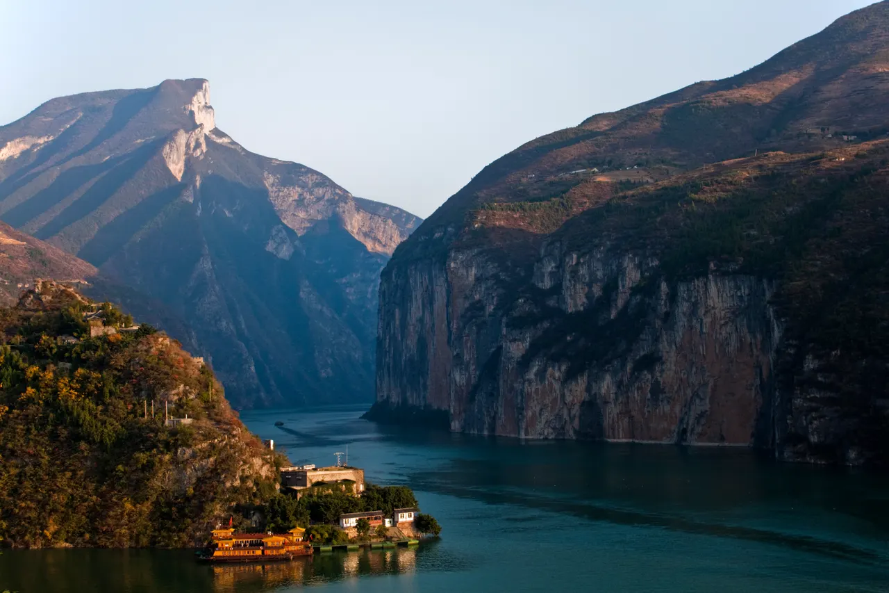 Steep cliffs frame the deep green Yangtze River at Qutang Gorge, viewed from Baidicheng.